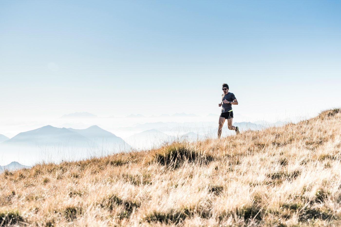 Trail runner on a mountain hillside